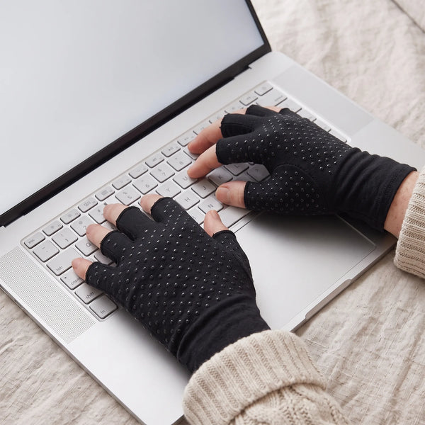 Gloved hands typing freely, fingertips left bare for full mobility